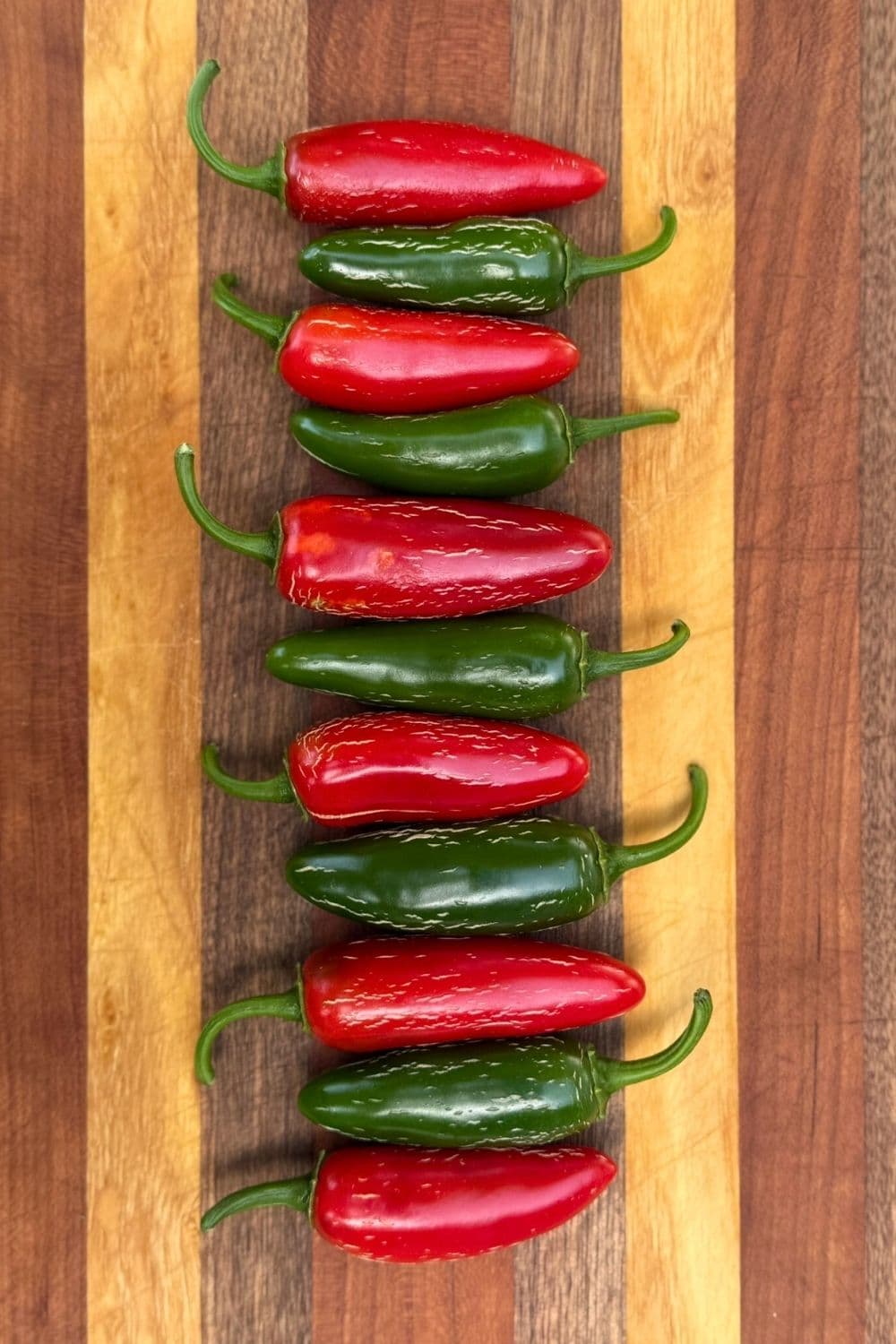 Fresh green and red jalapeños ready for roasting