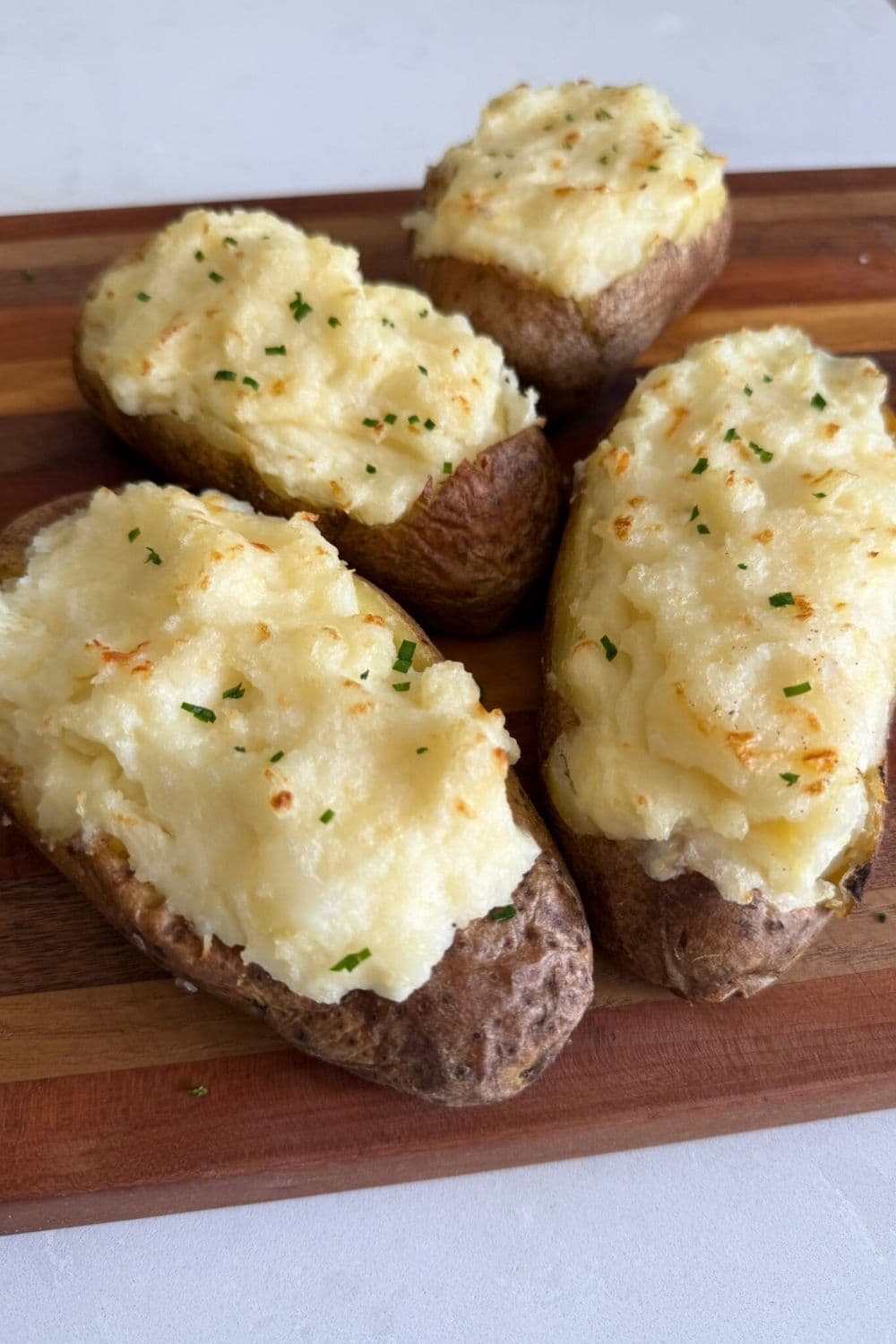 Twice-baked potatoes with melted cheese and chives
