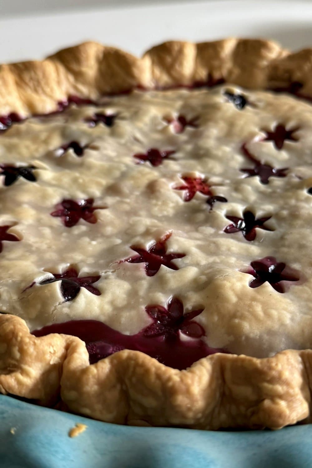 Berry pie with star cutouts crust