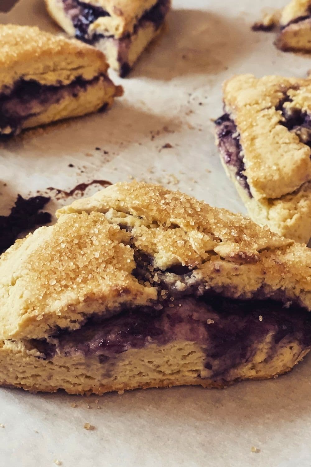 Fresh blueberry scones with lemon glaze on a cooling rack